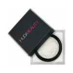Huda Beauty highlighter in white, featuring the Easy Bake Loose Baking & Setting Powder in Sugar Cookie, 20g.
