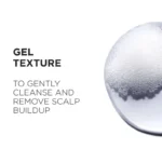 Kérastase Genesis Bain Hydra-Fortifiant Shampoo in a gel texture, designed to cleanse and remove scalp buildup effectively.