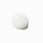 A white soap ball resting on a white surface, representing Kérastase Specifique Bain Prevention Shampoo for thinning hair.