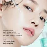 A woman examining her face in a mirror, with text overlay: "How to use Anua PDRN Hyaluronic Acid Capsule 100 Serum."