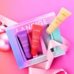 LANEIGE On-the-Glow Balm Trio, a gift set with three hydrating tinted lip balms, each 10g travel size.