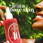 A woman holds a bottle from the Sol de Janeiro Cheirosa Perfume Mist Set, showcasing a tropical mini fragrance collection.